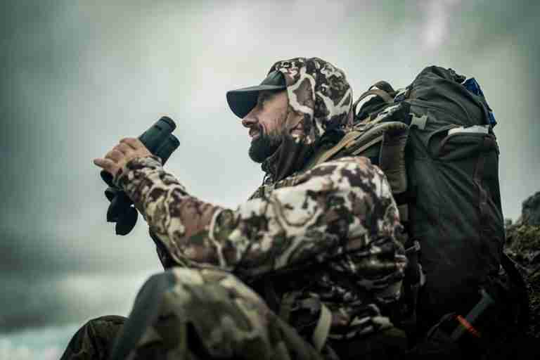 Kurt glassing with binoculars and a backcountry pack, staying fit for elk hunting over 60